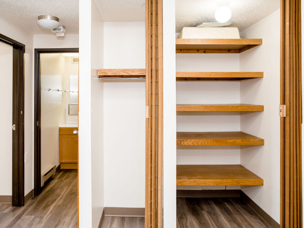 Wooden shelves in the entryway closet
